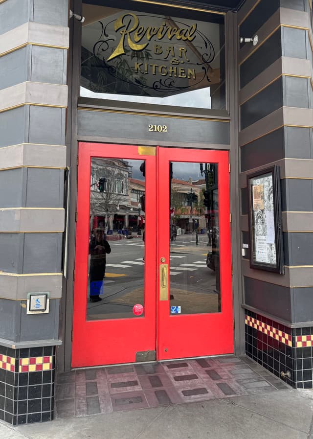 a restaurant door that is red