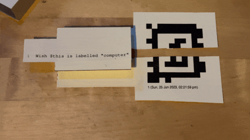 Folk computer showing interaction with paper button